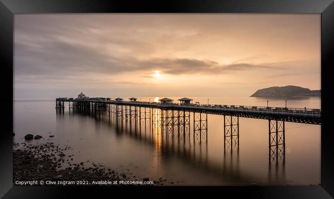 Pier at sunrise Framed Print by Clive Ingram