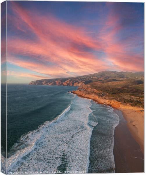 Aerial view from a beach at the sunset. Canvas Print by nuno valadas