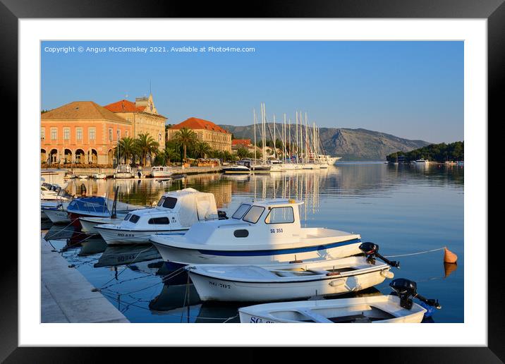 Boats moored in Stari Grad harbour, Croatia Framed Mounted Print by Angus McComiskey