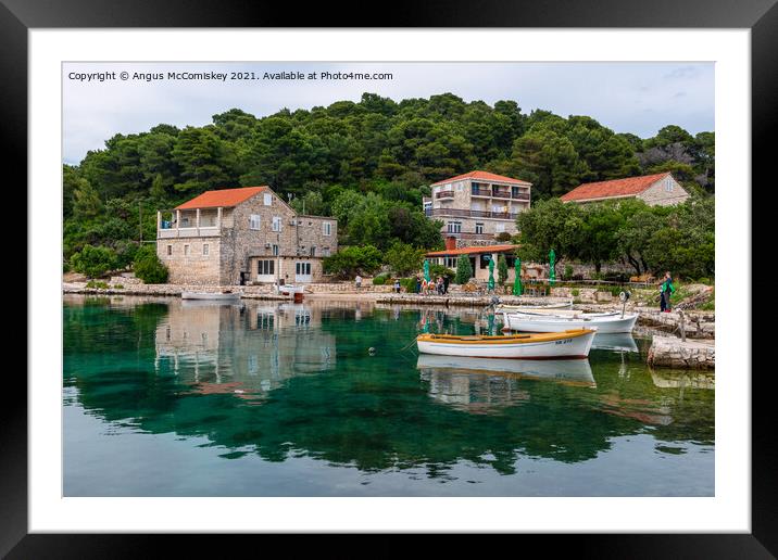 Colourful reflections in Pomena harbour, Croatia Framed Mounted Print by Angus McComiskey