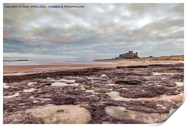 Bamburgh Castle under stormy sky Print by Kevin White