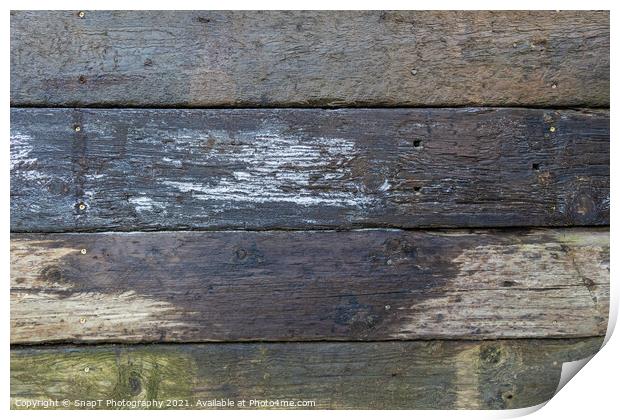 Abstract background of damp stacked wooden railway sleepers covered with frost Print by SnapT Photography