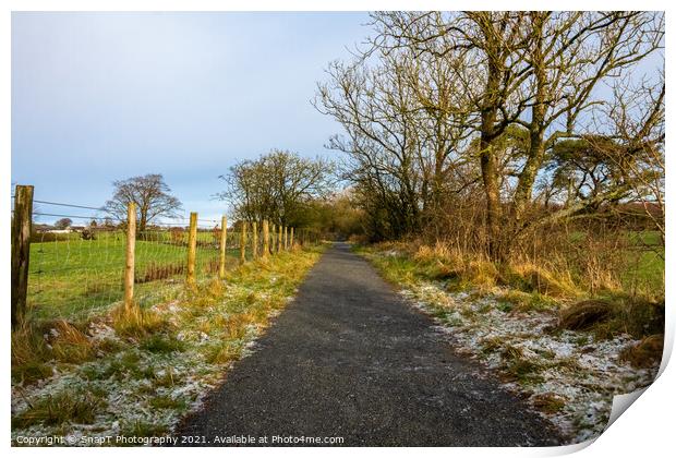 A frosty countryside trail, with snow on the ground, Scotland Print by SnapT Photography