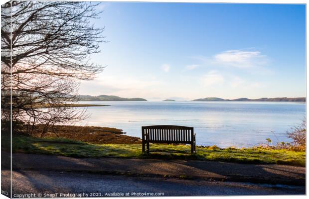 An empty wooden seat or bench over looking the sea at Kirkcudbright Bay Canvas Print by SnapT Photography