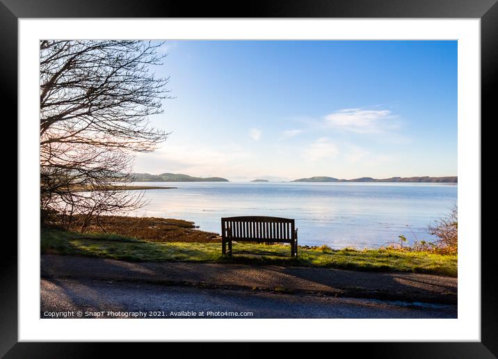 An empty wooden seat or bench over looking the sea at Kirkcudbright Bay Framed Mounted Print by SnapT Photography