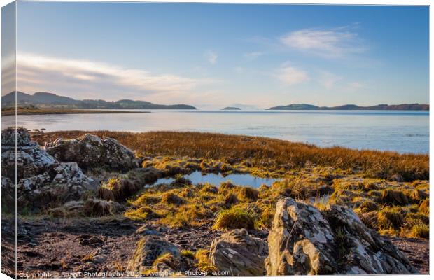 Rocky beach at Kirkcudbright bay at low tide on a sunny winters morning Canvas Print by SnapT Photography
