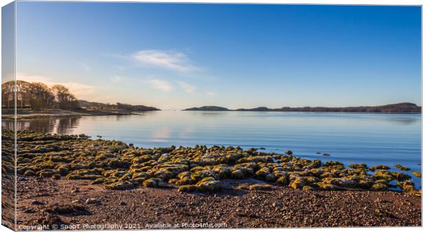 Rocky beach at low tide on a winters morning at Kirkcudbright Bay Canvas Print by SnapT Photography