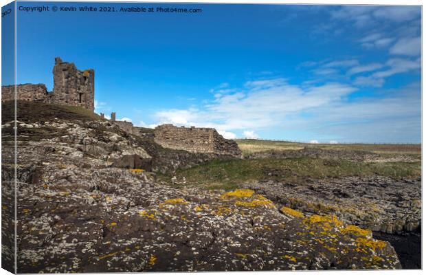 Dunstanburgh castle from St Margarets bay Canvas Print by Kevin White