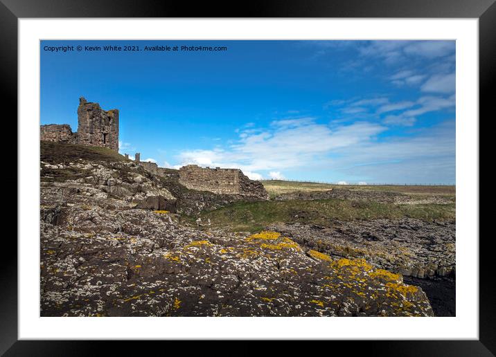 Dunstanburgh castle from St Margarets bay Framed Mounted Print by Kevin White