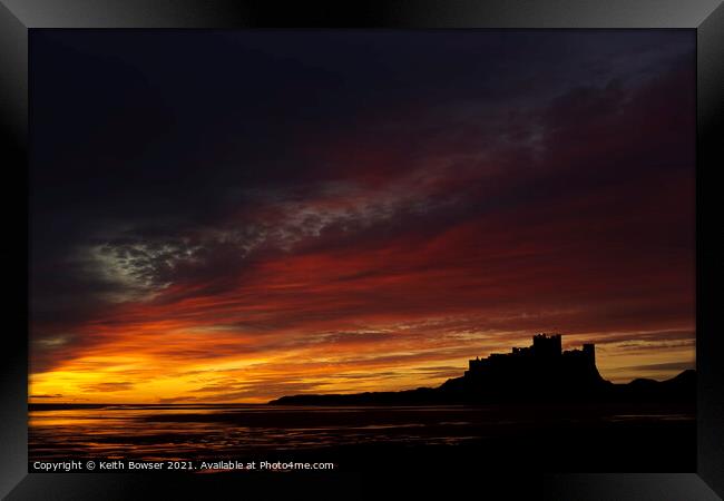Bamburgh Castle at sunrise Framed Print by Keith Bowser