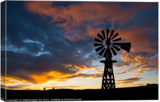 American windmill at sunset, dramatic sky Canvas Print by Delphimages Art