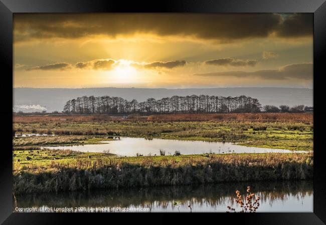 Sunset over the wetlands Framed Print by Phil Longfoot