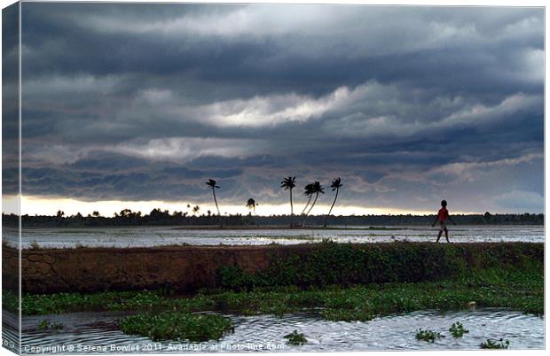 Boy Walking in a Storm, Kerala, India Canvas Print by Serena Bowles