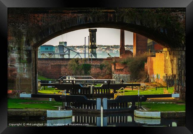 Canal locks into Leeds Liverpool Canal near Liverpool Framed Print by Phil Longfoot