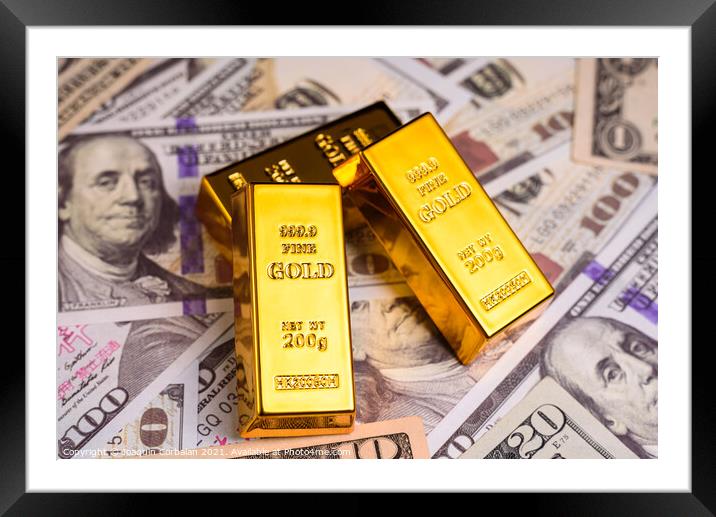 Gold bullion on American dollar bills, concept of commodities to Framed Mounted Print by Joaquin Corbalan