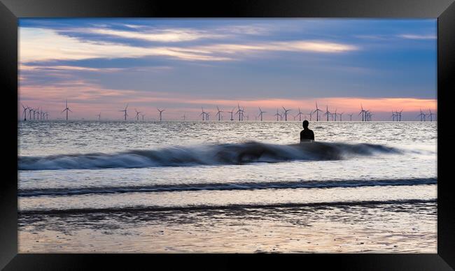 Waves splash against an Iron Man at high tide Framed Print by Jason Wells