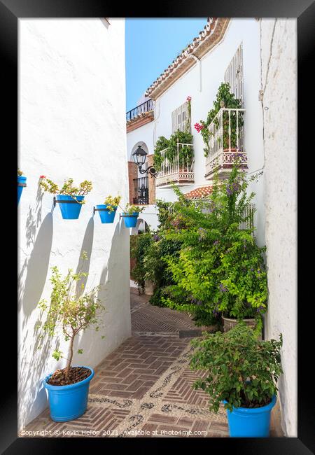 Blue plantpots against whitewashed walls Framed Print by Kevin Hellon