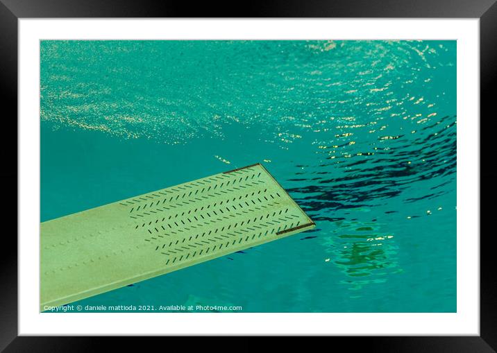 a springboard to dive into the pool Framed Mounted Print by daniele mattioda