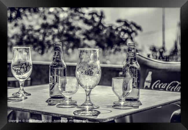 Beer bottles and glasses after an afternoon drinki Framed Print by Craig Ballinger