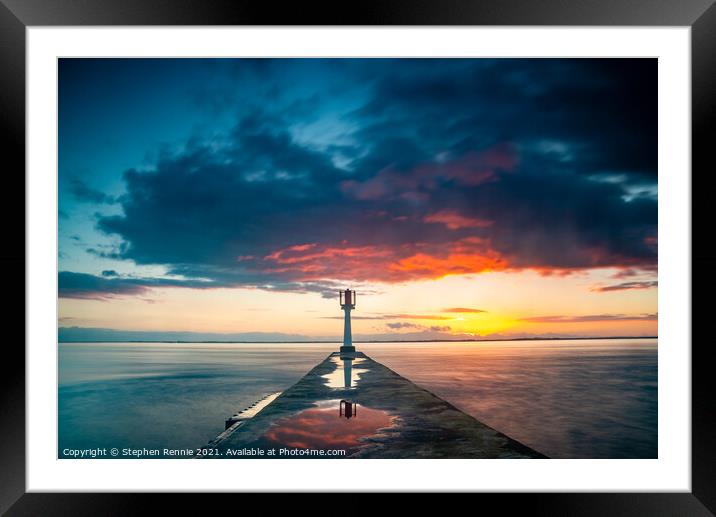 Light beacon and pier on Gironde estuary at sunset Framed Mounted Print by Stephen Rennie