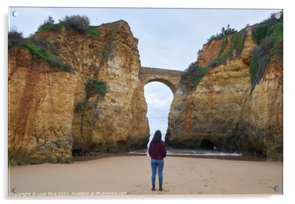 Woman traveler at Praia dos estudantes beach with arch bridge in Lagos, Portugal Acrylic by Luis Pina