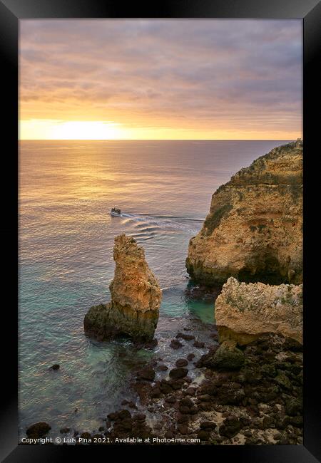 Ponta da Piedade and a boat in Lagos at sunrise, in Portugal Framed Print by Luis Pina