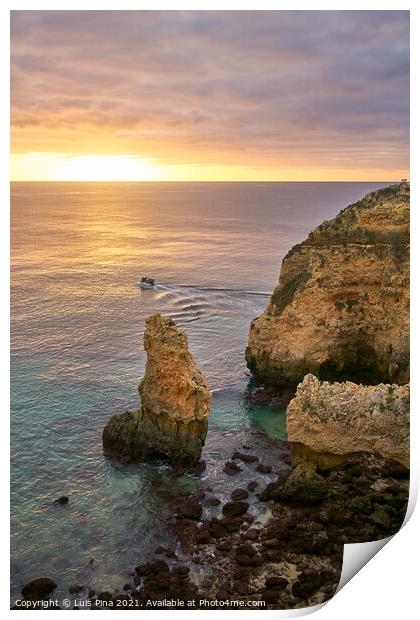 Ponta da Piedade and a boat in Lagos at sunrise, in Portugal Print by Luis Pina