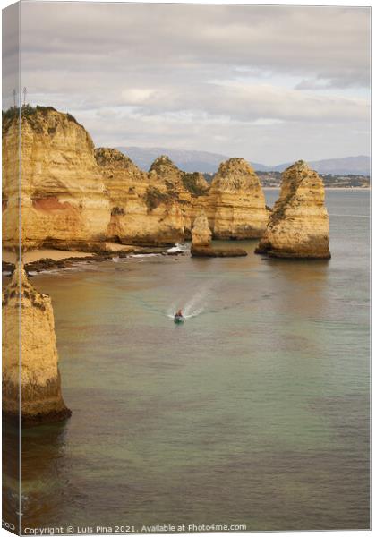 Ponta da Piedade and a boat in Lagos, in Portugal Canvas Print by Luis Pina