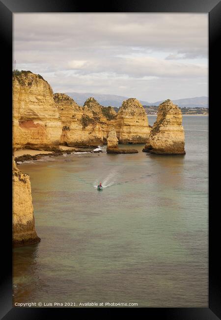 Ponta da Piedade and a boat in Lagos, in Portugal Framed Print by Luis Pina