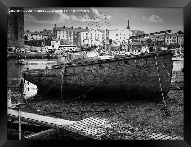Wrecked old boat opposite Caernarfon Castle Framed Print by Jules D Truman