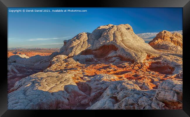 A Vibrant Sunrise Over Colorful Rock Formations Framed Print by Derek Daniel