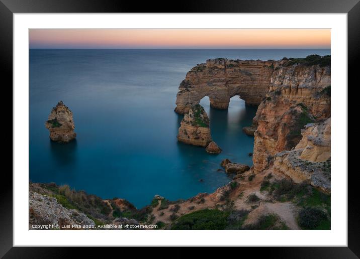 Natural arch cliffs of Praia da Marinha beach at sunset beautiful landscape with atlantic ocean, in Lagoa Portugal Framed Mounted Print by Luis Pina