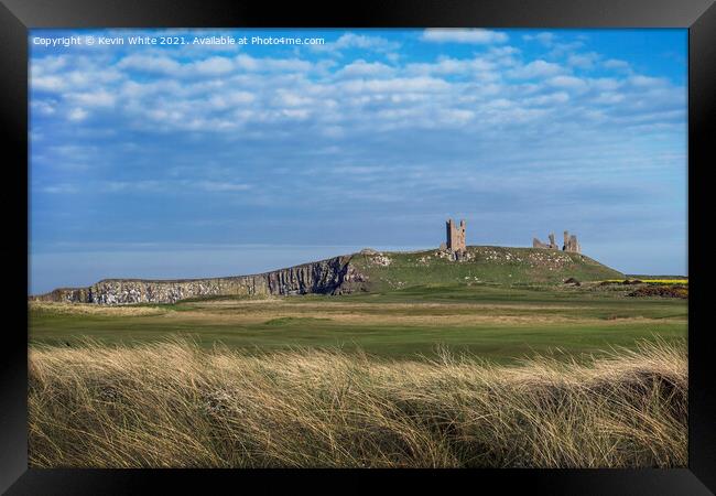 Dunstanburgh Castle from across golf course Framed Print by Kevin White