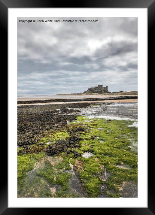 Bamburgh Castle at low tide Framed Mounted Print by Kevin White