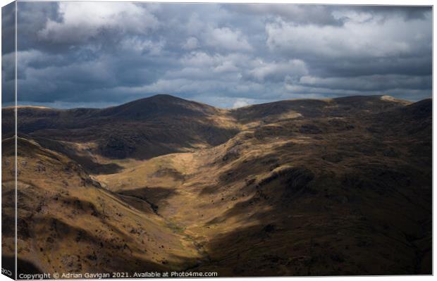 Abundance of clouds above Middle Fell  Canvas Print by Adrian Gavigan