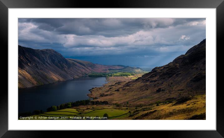 Shaft of Light hitting Low Wood by Wast Water Framed Mounted Print by Adrian Gavigan