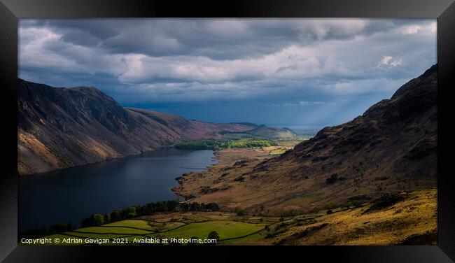 Shaft of Light hitting Low Wood by Wast Water Framed Print by Adrian Gavigan