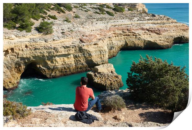 Man looking at a wild hidden secret beach with amazing turquoise water in Algarve, Portugal Print by Luis Pina
