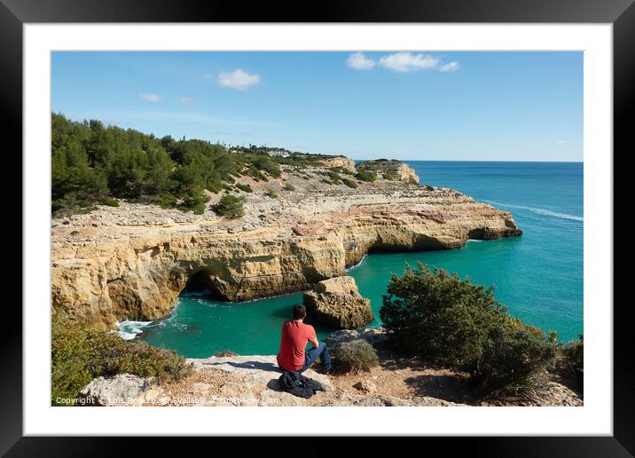 Man looking at a wild hidden secret beach with amazing turquoise water in Algarve, Portugal Framed Mounted Print by Luis Pina