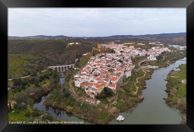 Mertola drone aerial view of the city and landscape with Guadiana river and medieval historic castle on the top in Alentejo, Portugal Framed Print by Luis Pina