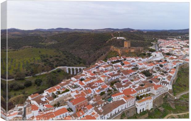 Mertola drone aerial view of the city and landscape with Guadiana river and medieval historic castle on the top in Alentejo, Portugal Canvas Print by Luis Pina