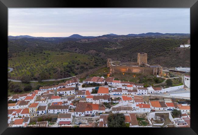 Mertola drone aerial view of the city and landscape with Guadiana river and medieval historic castle on the top in Alentejo, Portugal Framed Print by Luis Pina