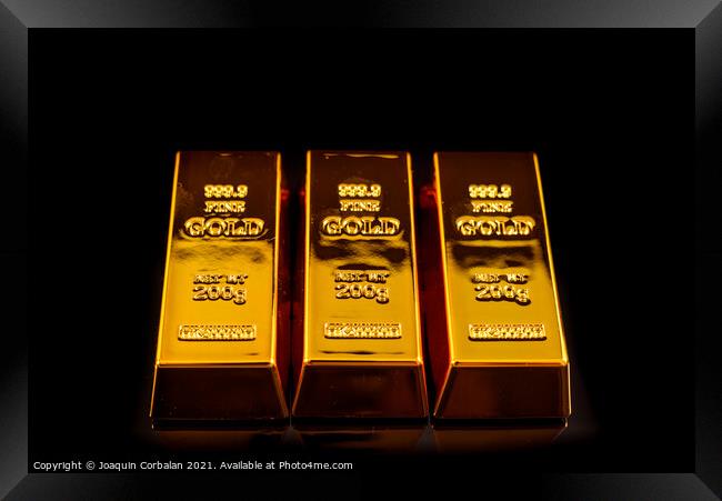 Gold bars isolated on black studio background, safe haven value  Framed Print by Joaquin Corbalan