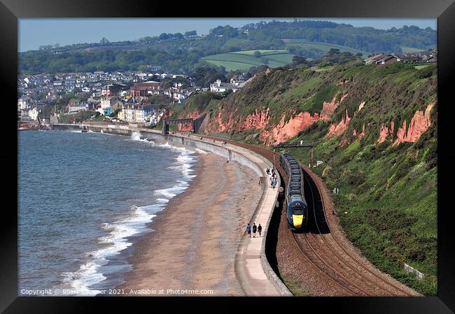 GWR train leaving Dawlish in South Devon  Framed Print by Rosie Spooner