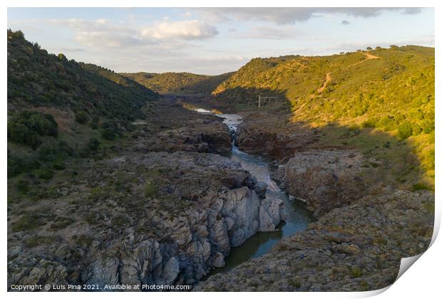 Pulo do Lobo waterfall drone aerial view with river guadiana and beautiful green valley landscape at sunset in Mertola Alentejo, Portugal Print by Luis Pina