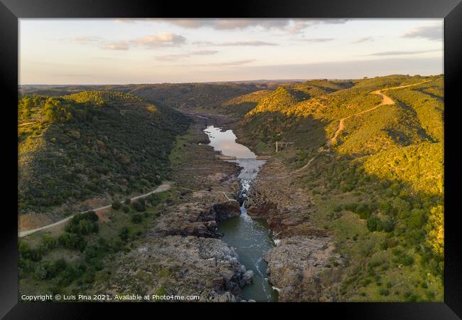 Pulo do Lobo waterfall drone aerial view with river guadiana and beautiful green valley landscape at sunset in Mertola Alentejo, Portugal Framed Print by Luis Pina