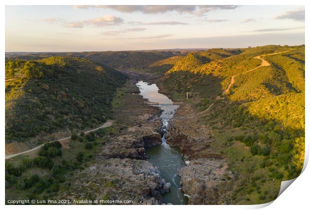 Pulo do Lobo waterfall drone aerial view with river guadiana and beautiful green valley landscape at sunset in Mertola Alentejo, Portugal Print by Luis Pina