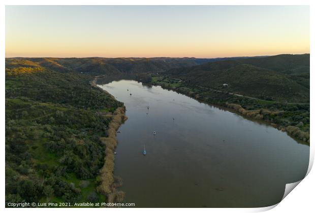 Aerial drone view of Sanlucar de Guadiana in Spain and Alcoutim in Portugal with sail boats on Guadiana river Print by Luis Pina