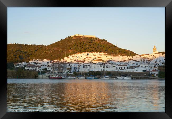 Sanlucar de Guadiana in Spain and Alcoutim in Portugal with sail boats on Guadiana river Framed Print by Luis Pina
