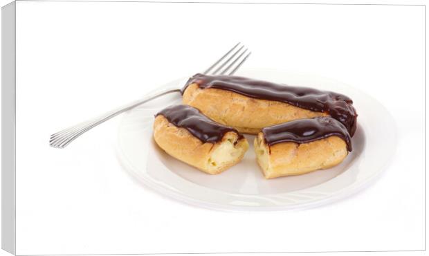 Two Chocolate Eclairs on a White Plate with a Fork Canvas Print by Darryl Brooks